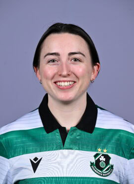 Shamrock Rovers football player smiling in team jersey, showcasing club badge and green-white colour.