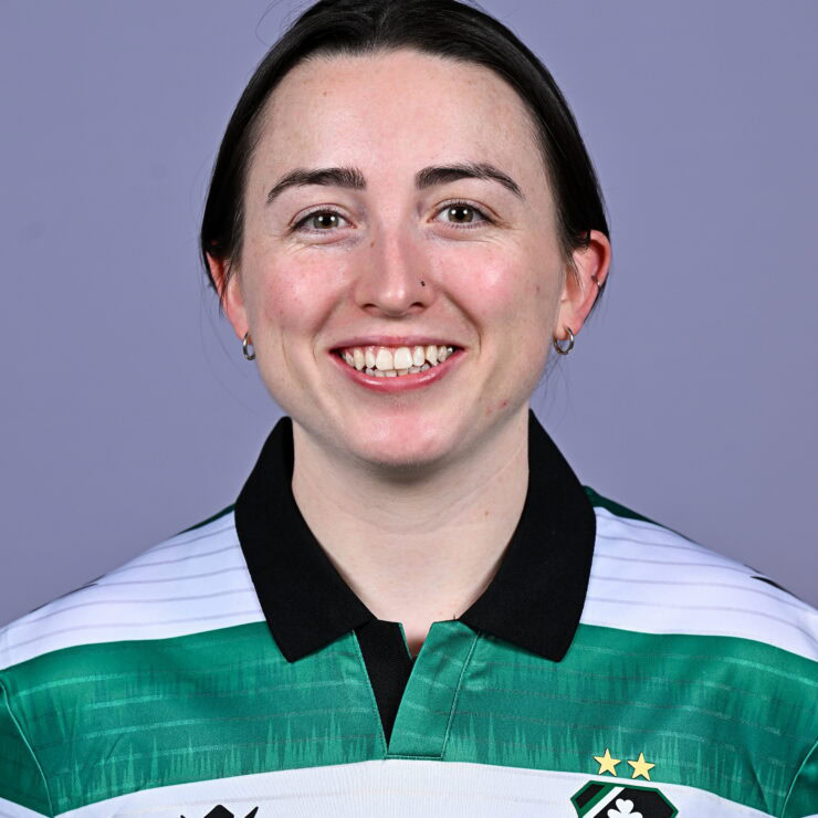 Shamrock Rovers football player smiling in team jersey, showcasing club badge and green-white colour.