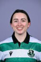 Shamrock Rovers football player smiling in team jersey, showcasing club badge and green-white colour.